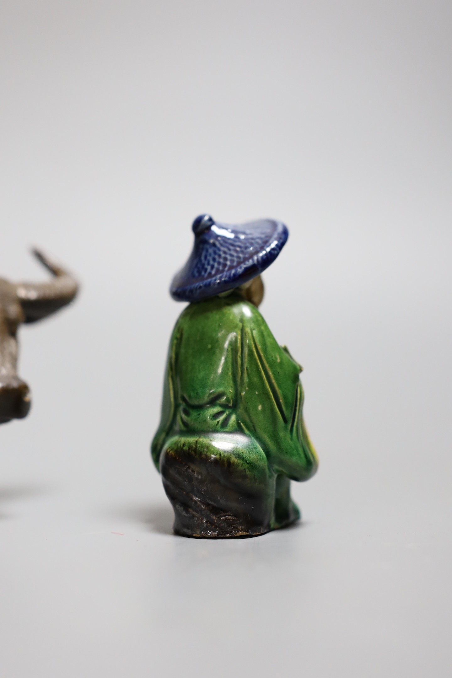 A Chinese Shiwan group of a girl on a buffalo and another, Girl on buffalo 20cms wide